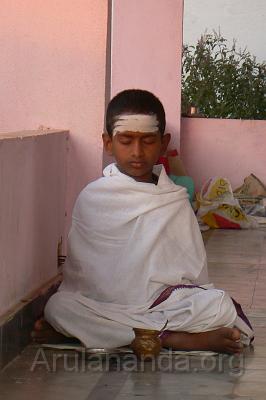 P1050973.JPG - Veda Pathashala student engrossed in Gayatri Japam during morning Sandhyavandanam