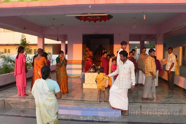 P1050974.JPG - Residents of the ashram participating in morning pujas