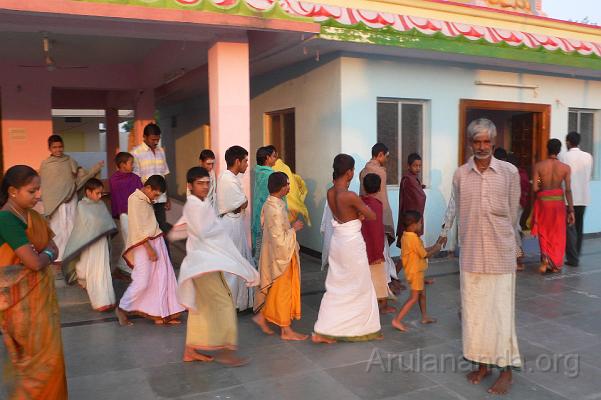 P1050975.JPG - Devotees following the arati from Shiva to Subramania temple